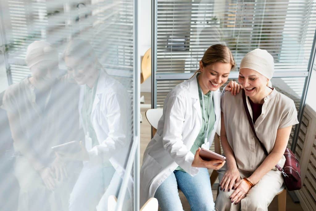 Middle aged woman with skin cancer talking to doctor