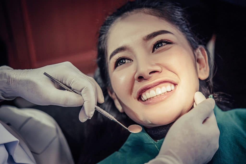 Dentist examining a patient's teeth